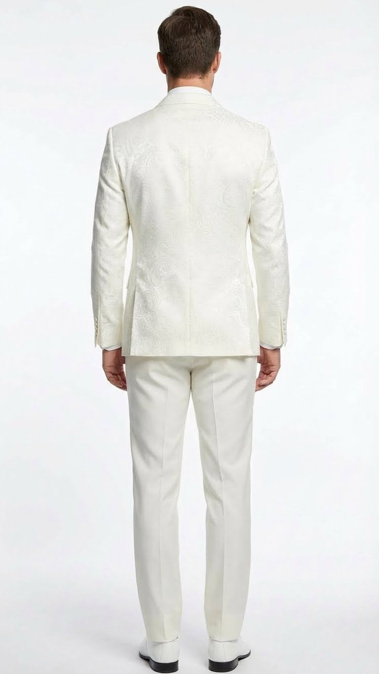 Ivory double-breasted tuxedo. Textured jacket with intricate pattern, structured shoulders, and tail hem. Paired with matching straight-leg trousers, fitted silhouette. Predominantly ivory.
