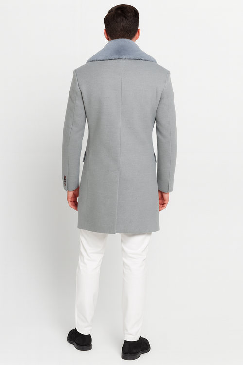 Men's light grey wool overcoat with faux fur shawl collar. Double-breasted, tailored fit with side pockets. Classic style.
