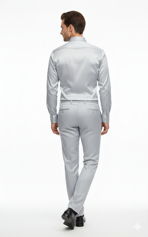 Silver satin slim-fit outfit: back view. Dress shirt with classic collar and button cuffs. Matching pants with a smooth finish and rear pockets.
