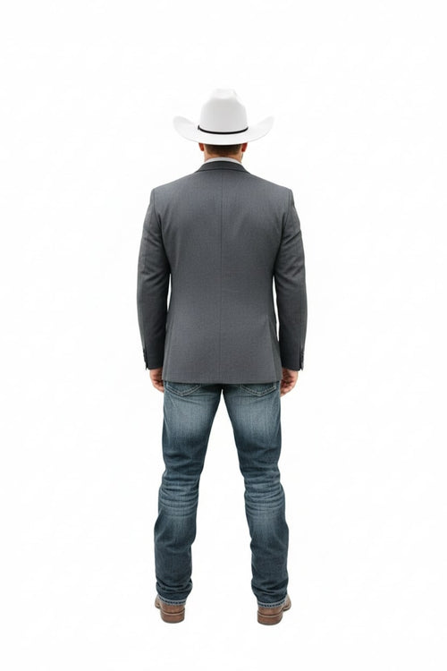 Gray western blazer with tailored fit, two-button closure, and notched lapels. Textured fabric offers a rugged yet formal look. Paired with blue jeans and brown boots for a classic cowboy style.
