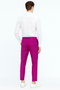 Men's slim fit dress pants in hot pink. Solid color, tailored design with two rear pockets. Tapered ankle.
