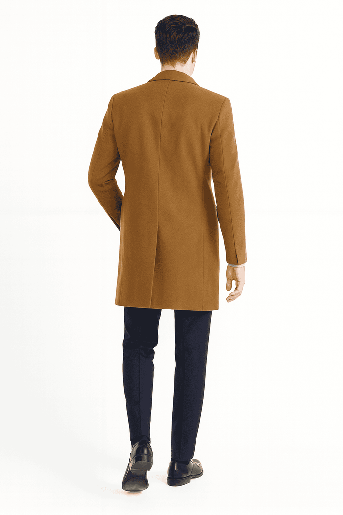 Alberto Nardoni men's camel wool overcoat. Sleek, straight cut with single back vent. Smooth, structured fabric. Minimalist design, no external fasteners or patterns. Consistent color and sleeve length.
