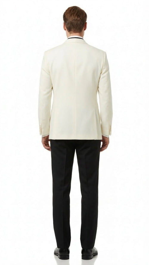 Alberto Nardoni men's ivory double-breasted tuxedo jacket. Tailored with shawl lapels, lightweight fabric, and buttoned cuffs. Contrasting look with black trousers. Single vent back.
