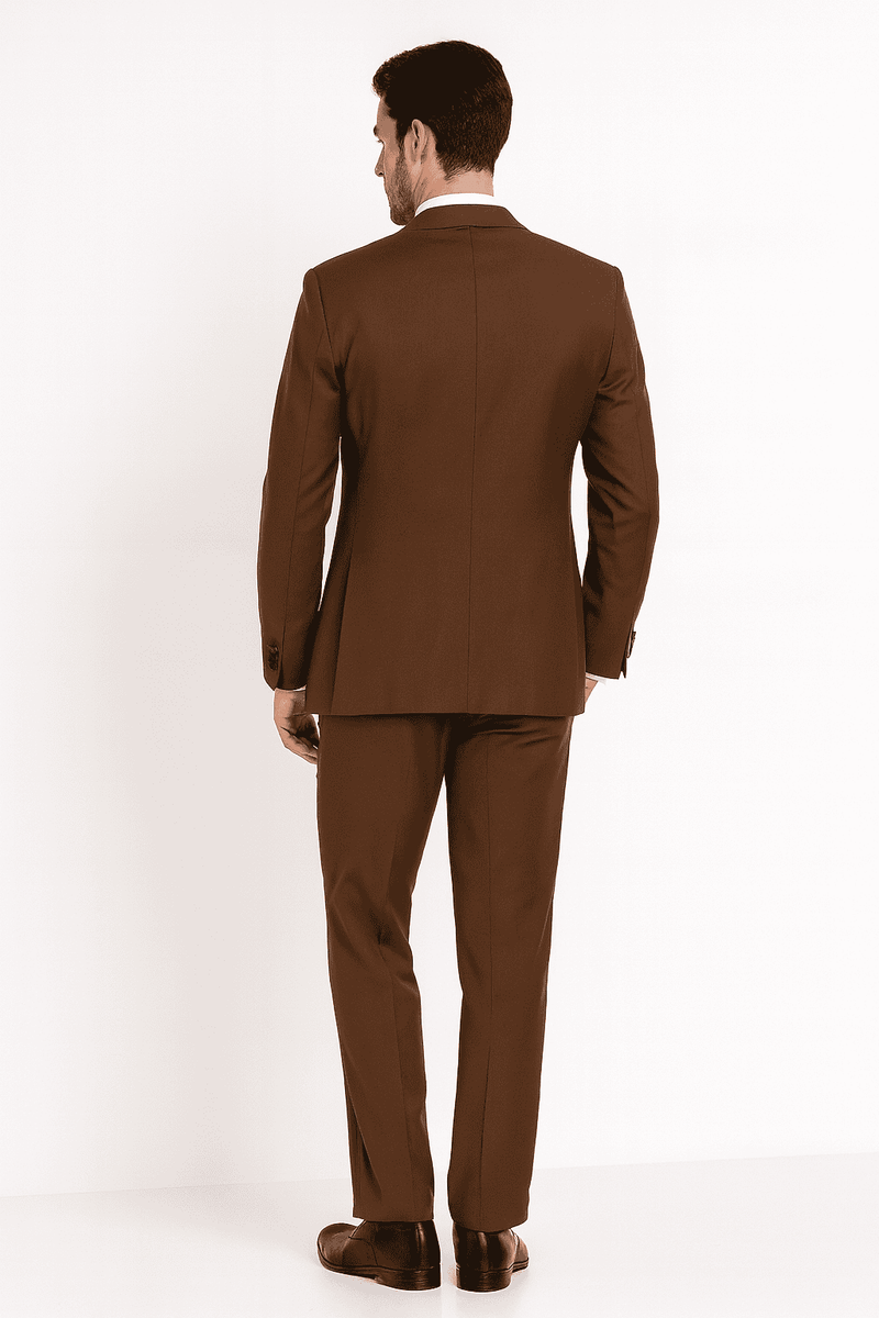 Light brown men's tuxedo suit with fitted jacket, black satin lapel, and matching trousers. Smooth fabric, polished look. Straight-cut trousers, clean back with single vent.

