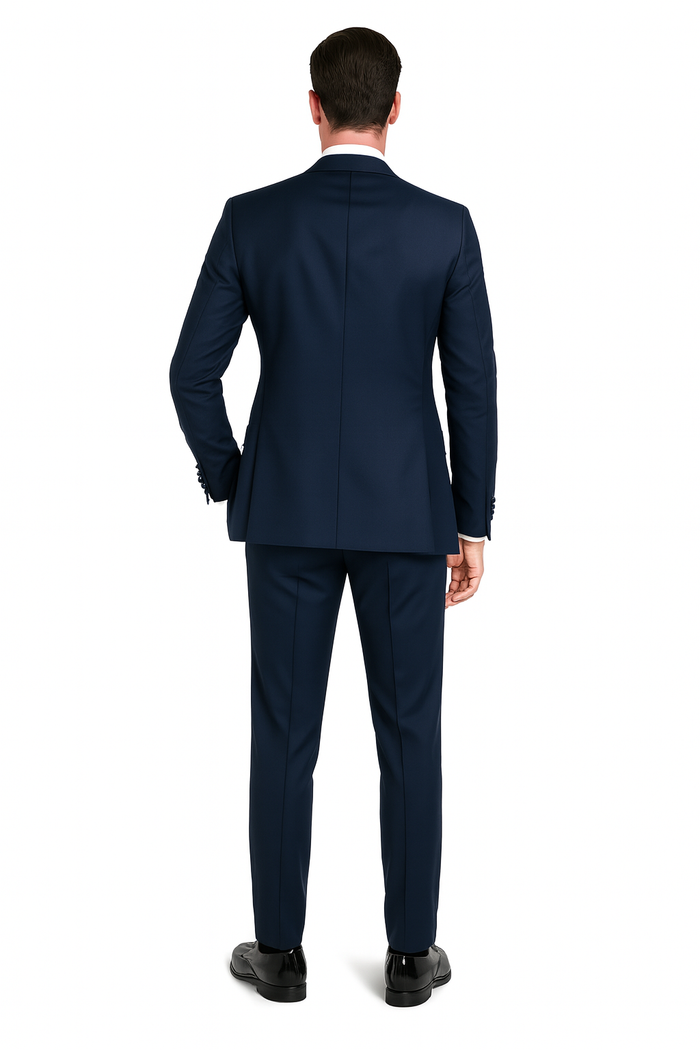 Navy blue men's tuxedo with satin peak lapel. Includes vest, pants & bow tie in navy sateen. A classic three-piece formal suit.
