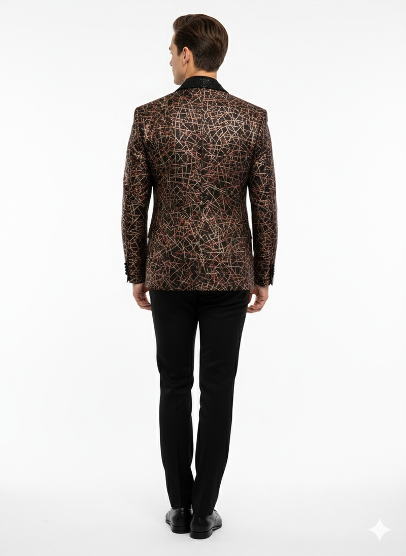 Black designer blazer with red & gold abstract pattern, notched collar & fitted shape. Luxurious sheen enhances intricate details. Paired with black trousers for a formal look.
