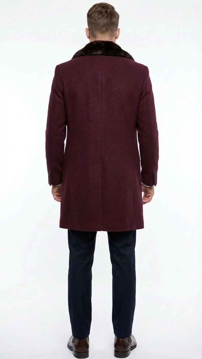 Men's burgundy three-quarter coat with faux fur collar. Sleek design, tailored structure, and straight cut. Features long, fitted sleeves with button cuffs. Made from wool-like material.
