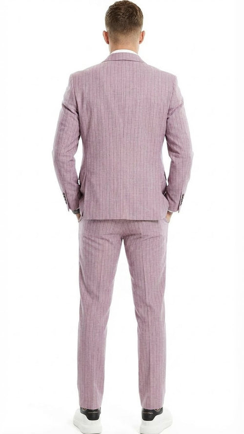 Men's dusty rose pink three-piece suit with fitted jacket, trousers, and vest. Subtle vertical pinstripe. Streamlined silhouette, uniform color.
