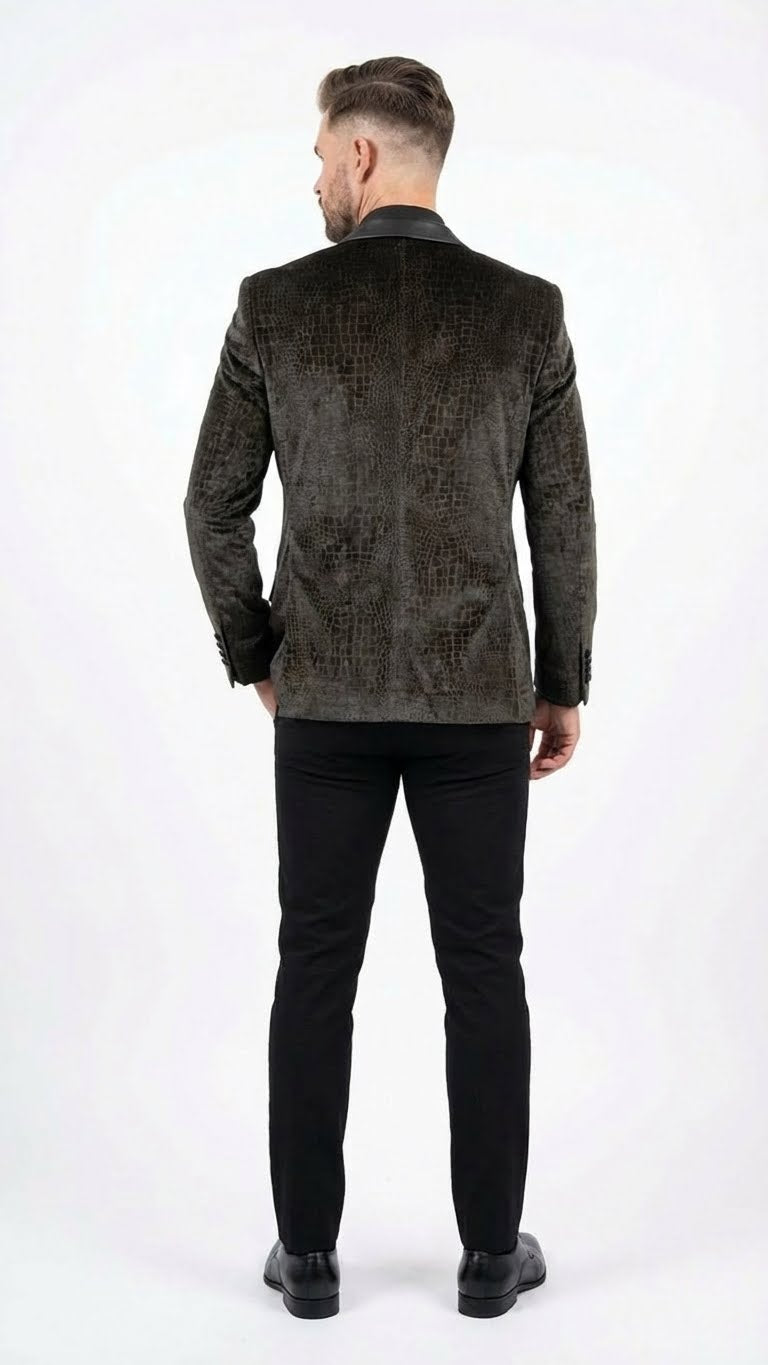 Men's blazer in dark green with exotic crocodile/alligator skin texture. Structured fit, reptilian scale pattern, black collar & buttons.
