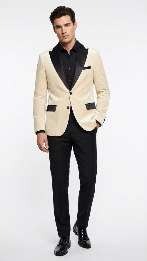 Ivory dinner jacket for men with cream velvet and black satin lapel. Features a two-button closure and black satin pocket flaps, offering a formal look.
