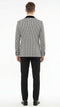 Men's black & white houndstooth tuxedo set: patterned blazer w/ velvet shawl lapel, paired w/ solid black trousers. Blazer features structured fit and contrasting lapel.
