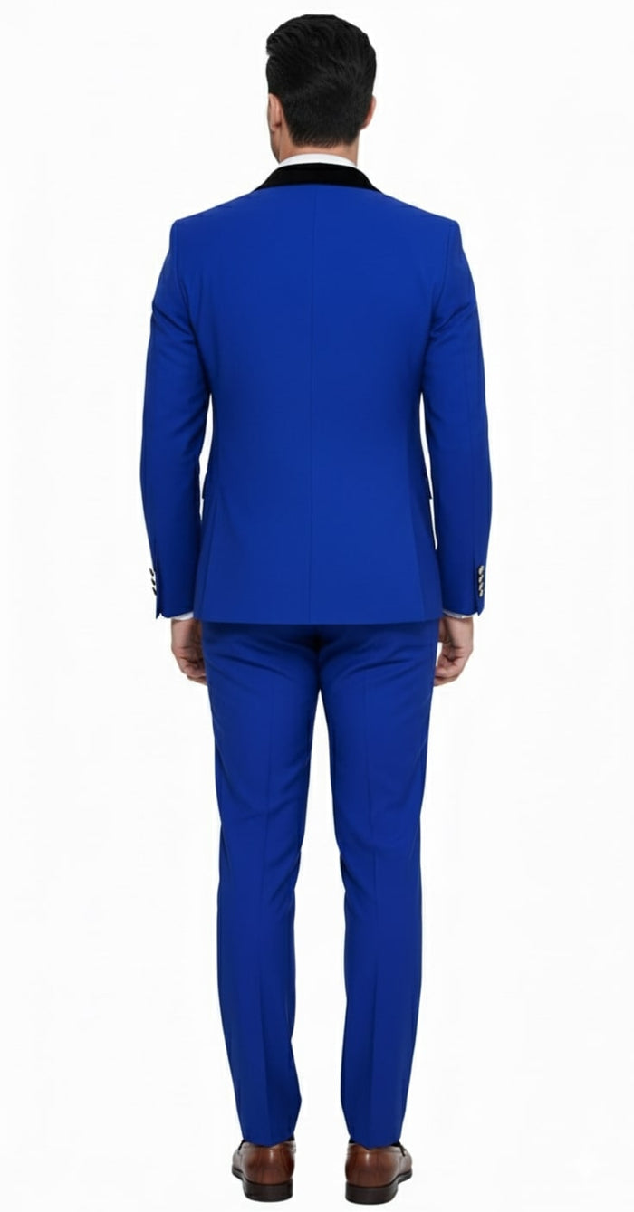 Royal blue, double-breasted men's tuxedo with slim fit. Black satin lapel and matching straight-leg trousers. Tailored fit with structured shoulders for a sleek, modern silhouette.
