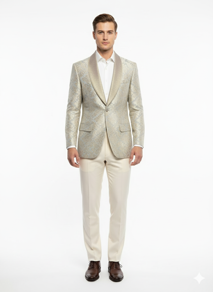 Men's luxury light tan blazer with champagne silver floral embroidery. Shawl collar, two front pockets, and a tailored fit for a sophisticated look.
