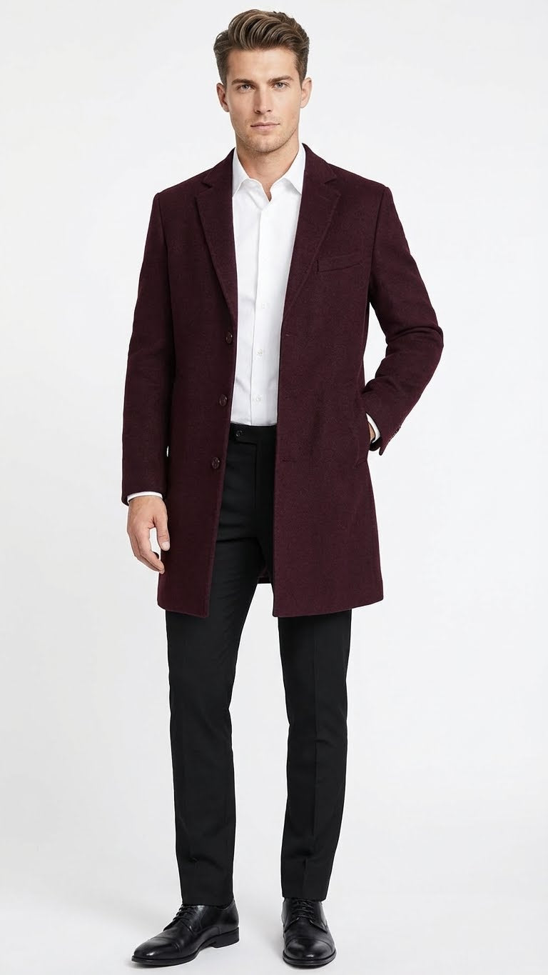 Men's burgundy wool blend overcoat with classic fit. Features notched lapel, single-breasted three-button closure, and side pockets. Textured fabric, straight silhouette, mid-thigh length.
