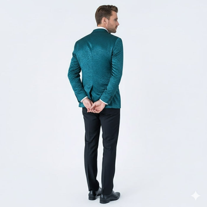 Teal blue paisley tuxedo jacket (back view) with shawl lapel. Textured pattern visible. Paired with black trousers and shoes. Elegant and stylish.
