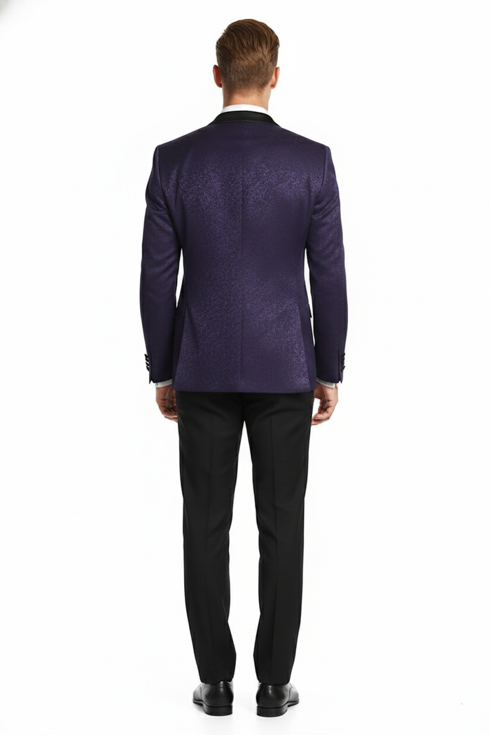 Purple paisley tuxedo jacket. Structured, tailored silhouette. Features black notch lapel and covered buttons. Intricate paisley pattern on rich purple. Smooth back. Lustrous blend of materials. Elegant design.
