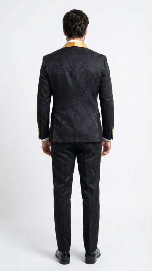 Men's slim-fit black jacquard tuxedo suit with gold lapel, textured pattern, and matching pants. Back view.
