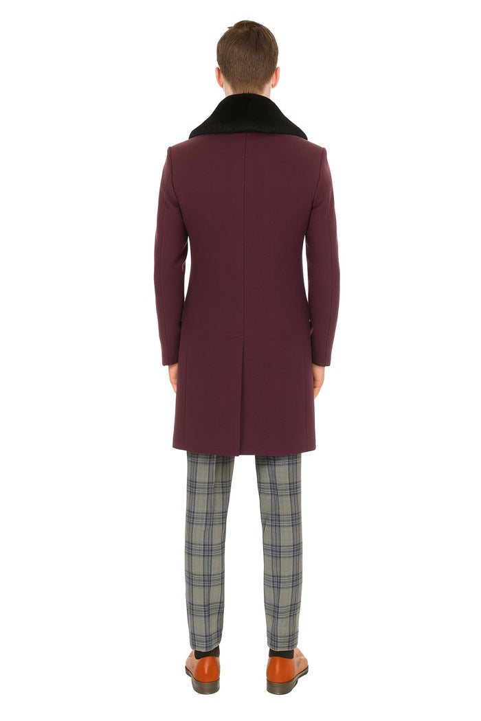 Men's purple wool overcoat with black faux fur collar. Tailored, straight cut, back vent. Deep purple, smooth fabric.
