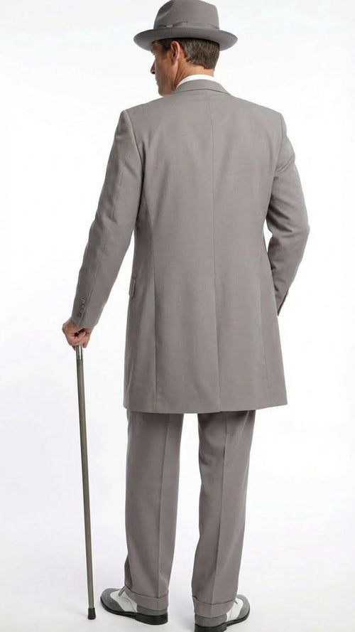 Men's gray zoot suit: long coat, wide lapels, tailored fit, matching tapered trousers. Includes a gray hat with a narrow brim and two-tone 1920s shoes.
