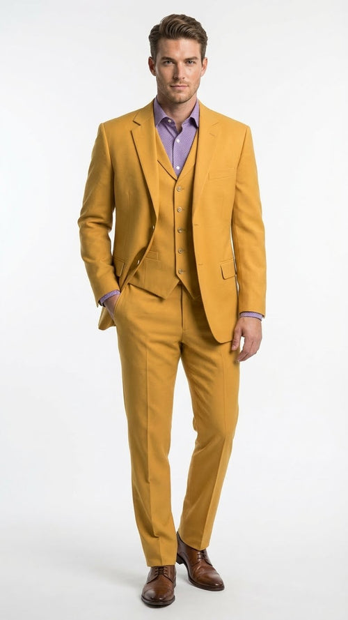 Mustard yellow three-piece men's suit: modern fit, two-button notch lapel jacket, matching vest & straight-cut trousers. Solid color, structured silhouette. Brown dress shoes complete the look.
