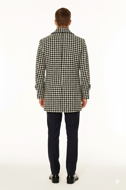 Men's houndstooth double-breasted overcoat. Classic black and white wool blend, structured form, notched collar, knee-length. Buttoned cuffs, clean finish.
