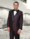 Burgundy one-button tuxedo with shiny fabric and contrasting shawl lapel. Includes a built-in vest, classic fit. Worn with white shirt & black bow tie. Tailored silhouette.
