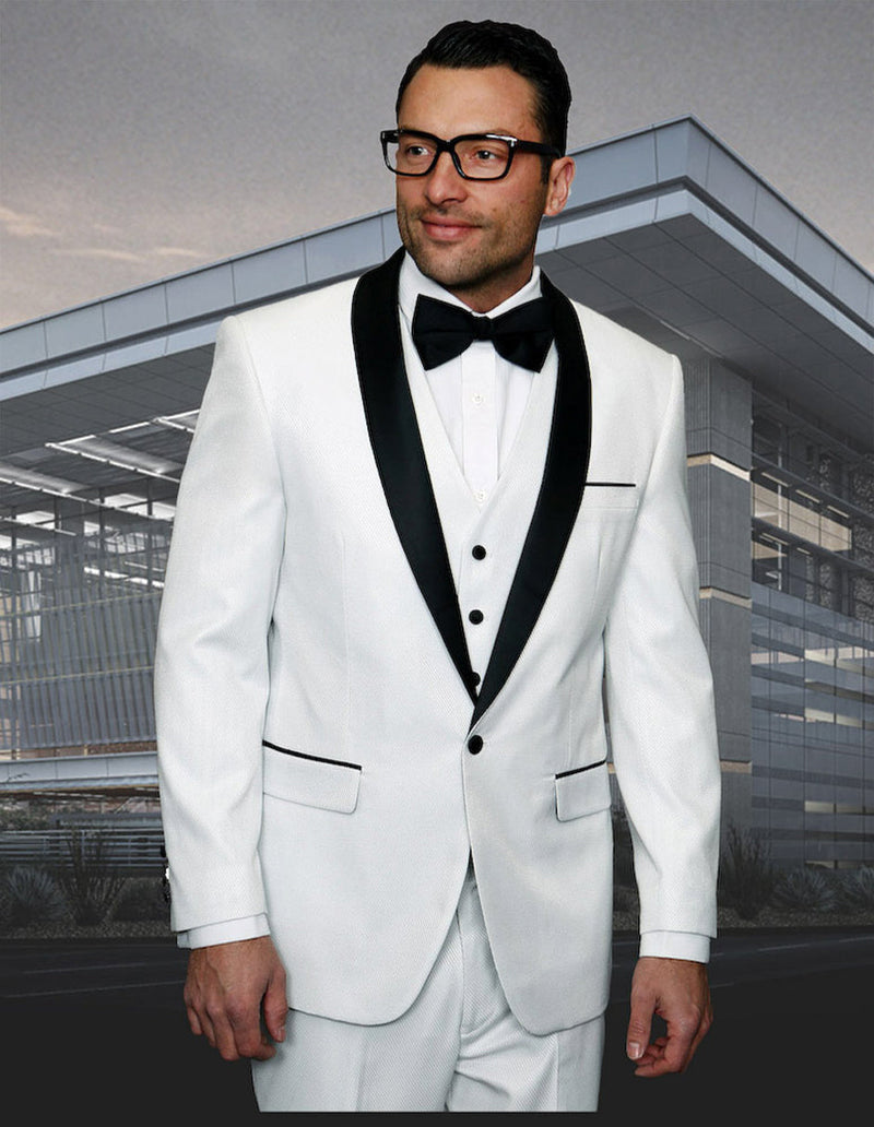 White men's one-button tuxedo with shiny sharkskin fabric, shawl lapel, and black accents. Includes a white dress shirt and black bow tie. Tailored fit with structured shoulders and tapered trousers.
