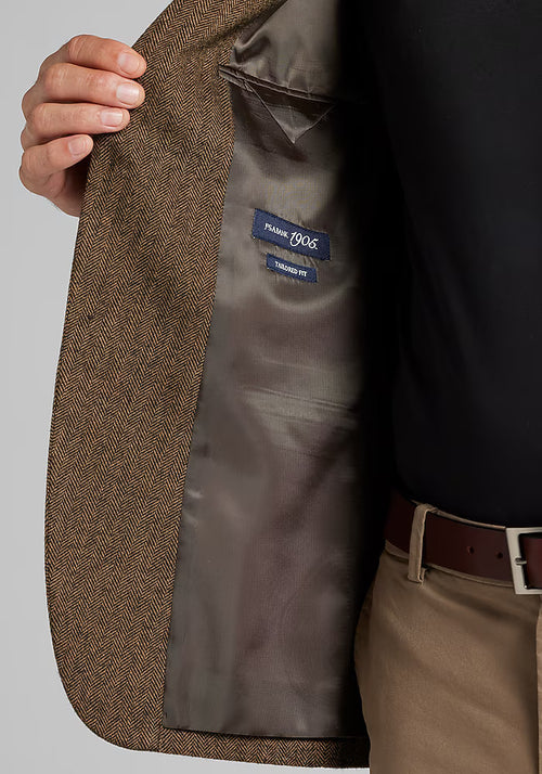 Alberto Nardoni 1905 sportcoat. Brown herringbone exterior, neutral lining. Tailored fit, structured shape with lapels. Interior brand label visible.