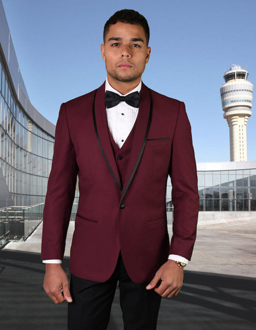 Burgundy wool tuxedo with shawl lapel and satin trim, black accents. Fitted, vested style with multiple buttons. Formal and elegant.

