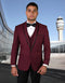 Burgundy wool tuxedo with shawl lapel and satin trim, black accents. Fitted, vested style with multiple buttons. Formal and elegant.
