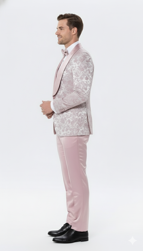 Men's dusty rose floral tuxedo suit: structured jacket with satin lapel and detailed floral patterns. Tailored pants. Smooth, glossy pale pink fabric.
