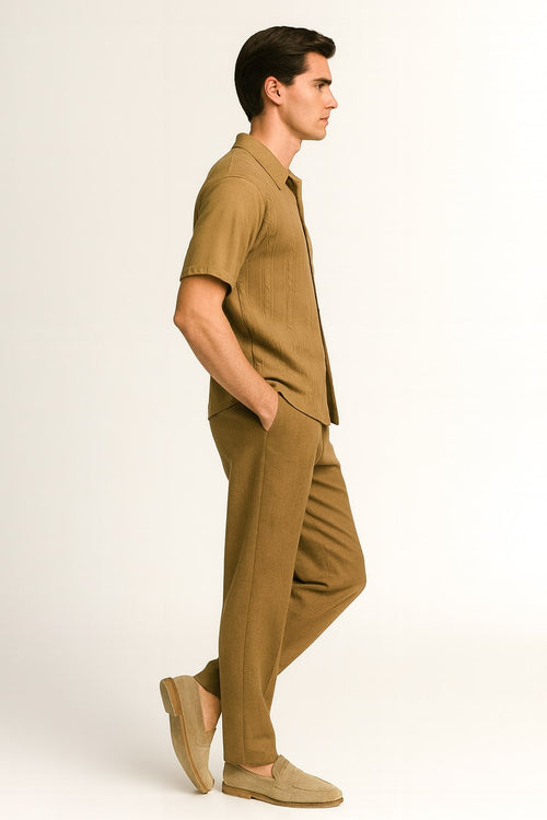 Men's mocha brown knit walking suit. Short sleeve button-down shirt with collar and relaxed-fit trousers. Taupe coffee color. Ribbed detailing. Soft, lightweight fabric.
