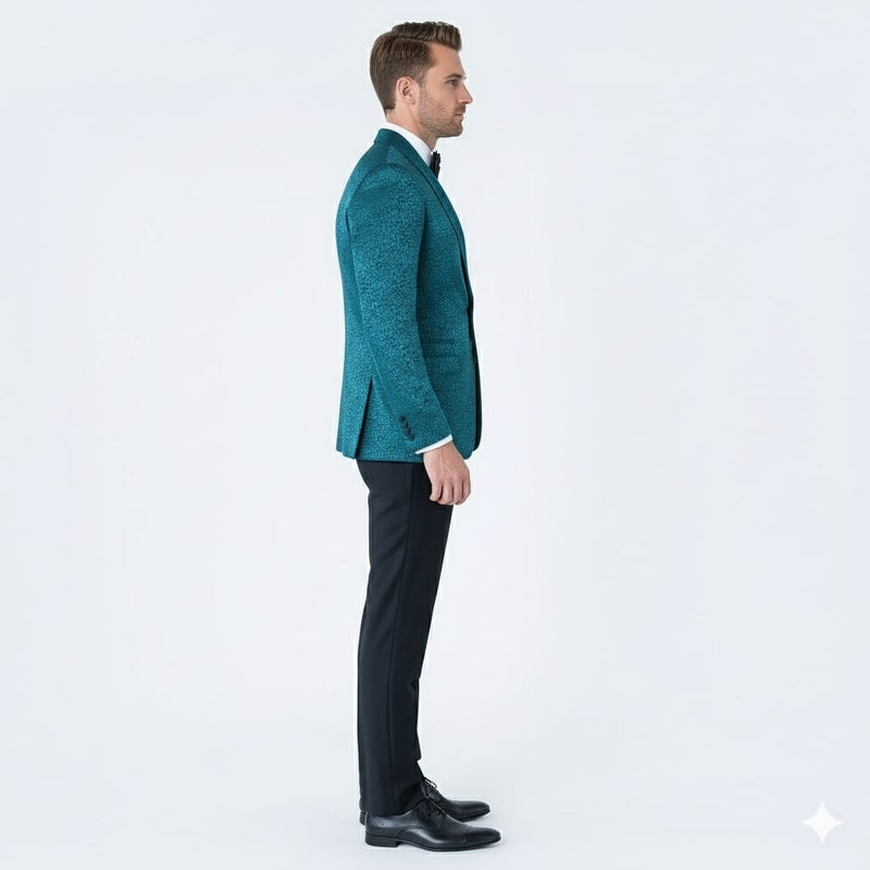 Teal blue men's tuxedo jacket with a shawl lapel and elegant cut. Textured greenish-blue paisley pattern fabric. Sophisticated and stylish.
