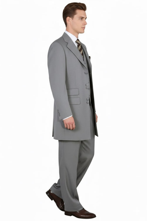 Light gray zoot suit: tailored jacket (3 buttons, wide lapels), vest, and wide-legged trousers. Smooth fabric.