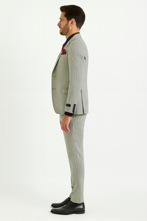 Light grey pinstripe 3-piece suit for men. Includes fitted blazer, tapered trousers, and matching vest. Features structured shoulders, single-breasted design, ankle-length trousers, and contrasting black cuff detailing with a burgundy pocket square.