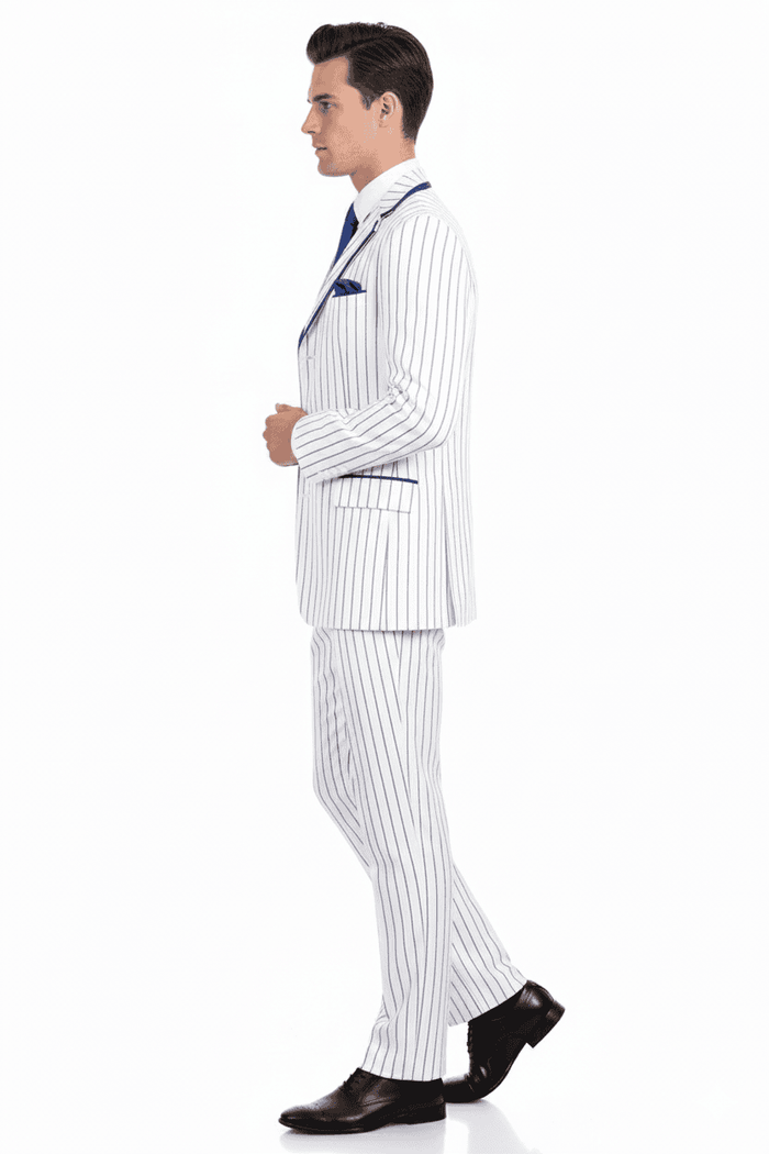 Men's three-piece suit: white & royal blue pinstripes. Classic fit blazer w/ notched lapel, matching vest, slim-fit pants, and tie. Smooth, structured fabric. Formal appearance.
