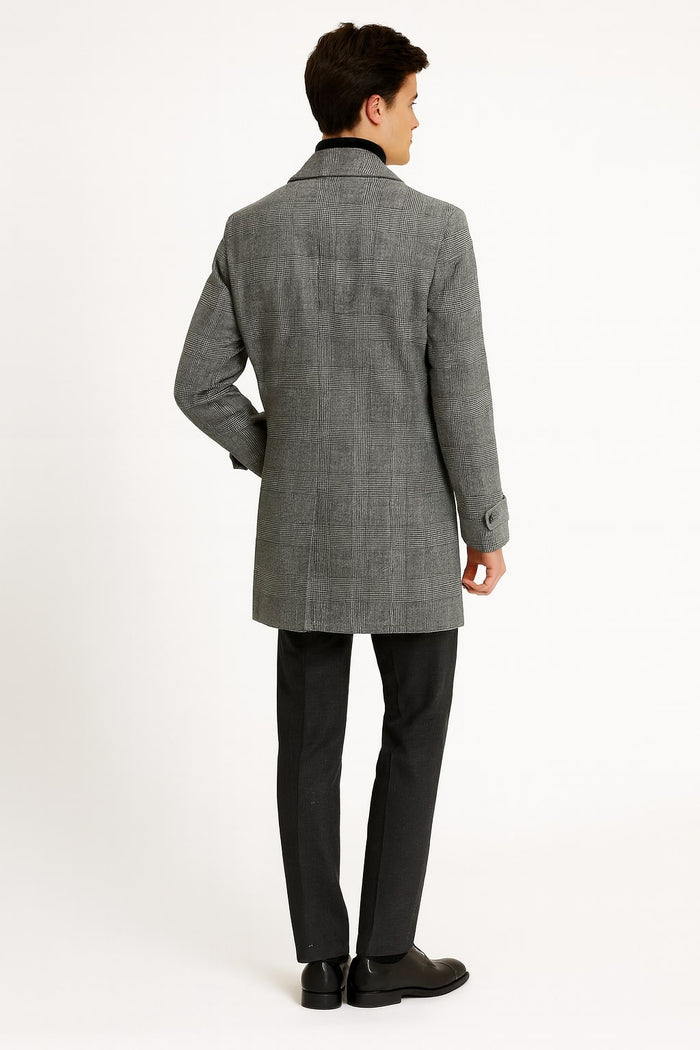 Men's grey plaid overcoat with double-breasted cut & faux fur collar. Straight, mid-thigh length. Textured fabric, button details & matching cuffs. Classic design.
