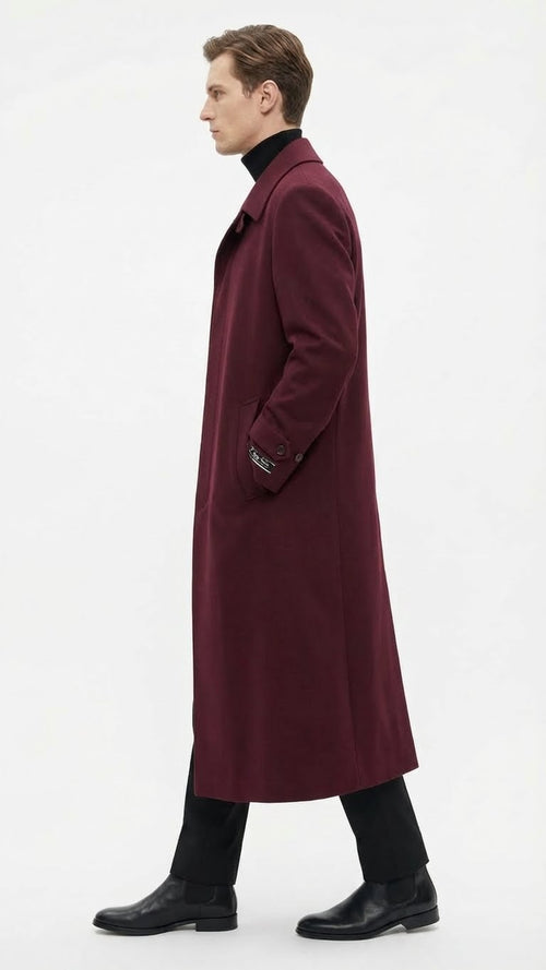Men's burgundy overcoat with a straight silhouette, classic collar, and side pockets. Solid fabric, long sleeves, and mid-calf length. Uniform burgundy color.
