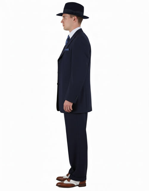 Men's 1920s navy zoot suit: long fitted jacket, pleated pants, fedora, wingtips. Classic cut, smooth fabric.