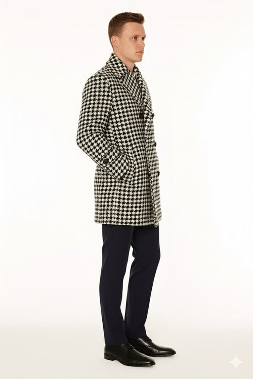 Men's double-breasted overcoat. Houndstooth pattern (black/white), wool blend. Notched lapel, two pockets, relaxed fit. Textured, warm fabric.
