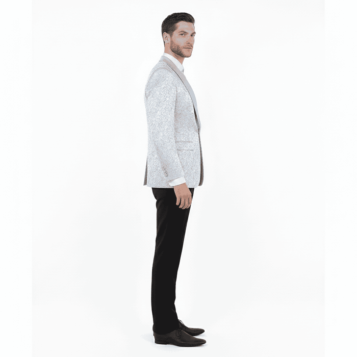 Silver-gray paisley tuxedo jacket for big & tall men. Satin shawl lapel, structured fit, single-button closure. Paired with black pants. Subtle pattern.
