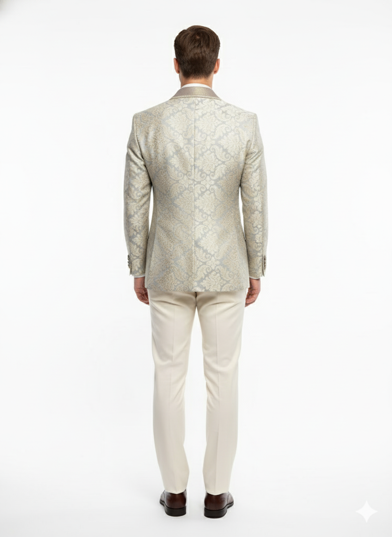 Champagne, silver, and cream floral men's blazer. Light tan base. Structured shoulders, tailored fit. Elegant embroidery visible on the back. Luxury style.

