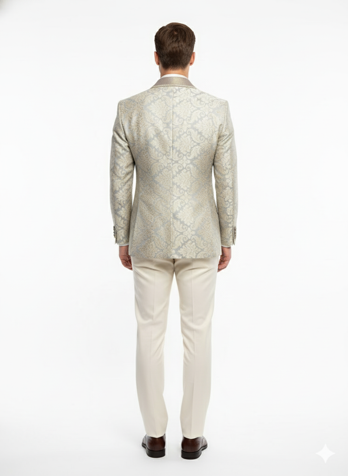 Champagne, silver, and cream floral men's blazer. Light tan base. Structured shoulders, tailored fit. Elegant embroidery visible on the back. Luxury style.
