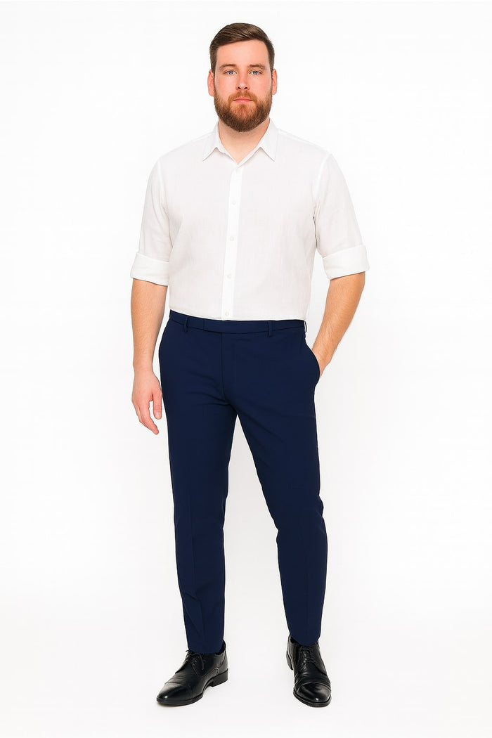 Men's white linen button-down shirt. Long sleeves rolled up, classic collar, and straight cut. Lightweight, breathable linen. Solid white with a button placket.
