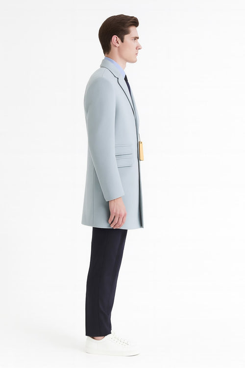 Men's light blue wool overcoat. Modern long design, classic tailored fit. Soft sky blue color, structured silhouette, single-breasted, two front pockets.
