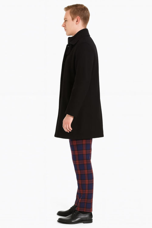 Men's black wool overcoat: single-breasted, structured collar, straight silhouette. Long sleeves, button closure. Solid black wool, fully lined. Mid-thigh length, classic winter wear.
