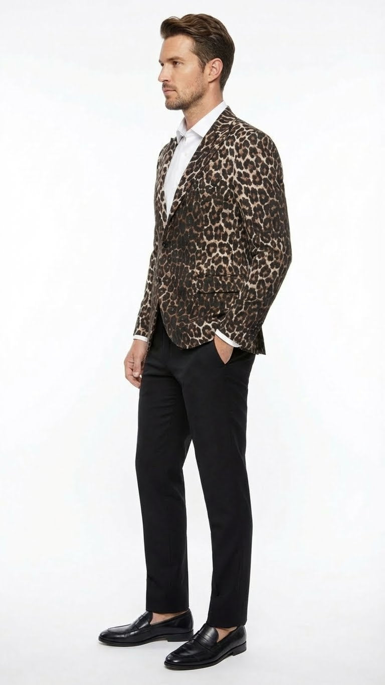 Alberto Nardoni men's leopard print blazer. Fitted, single-button closure, long sleeves. Textured material with brown/black leopard pattern. Notched lapels, two pockets. Worn with black trousers/shoes.
