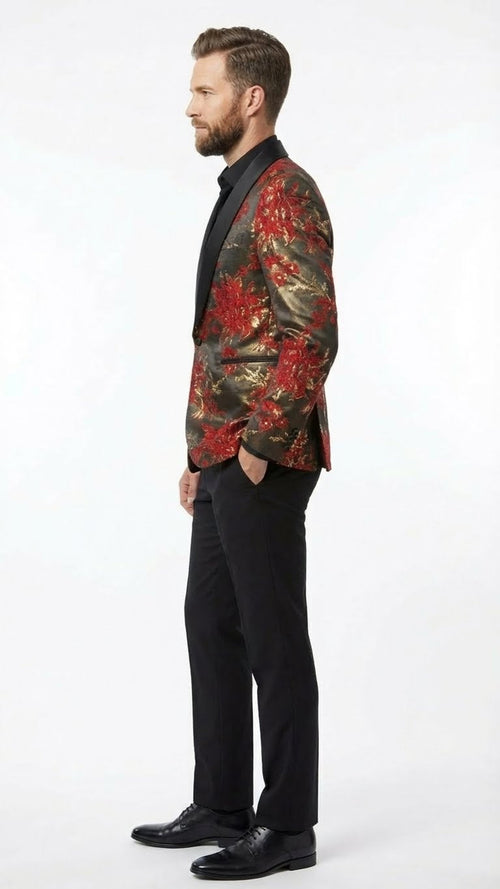 Men's red and gold paisley shawl lapel jacket. Fitted silhouette with elaborate floral designs on a dark background. Glossy fabric and shawl lapel for elegance and bold style. Paired with black trousers.
