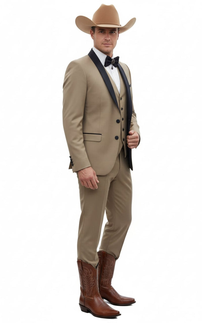 Tan three-piece cowboy suit: fitted blazer with black lapel, beige vest, matching pants. Brown cowboy boots with decorative stitching complete the outfit.
