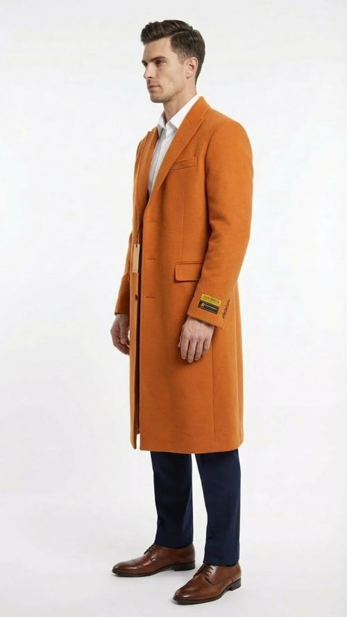Alberto Nardoni men's orange rust wool blend overcoat. Straight silhouette, single-breasted, notch lapels, side pockets. Textured wool blend fabric. Knee-length, long sleeves, cuff label.
